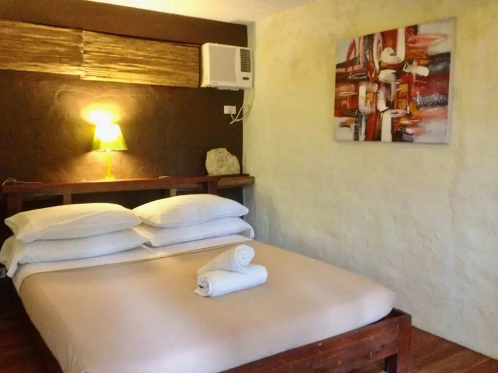 A Cottage Room bed with fresh linens