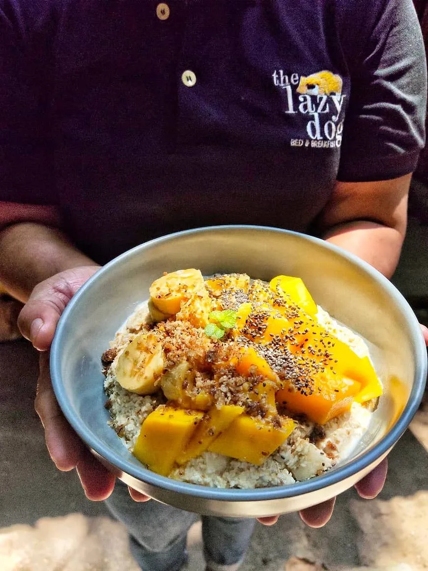 A tropical smoothie bowl with mango, banana and chia, served in a steel bowl